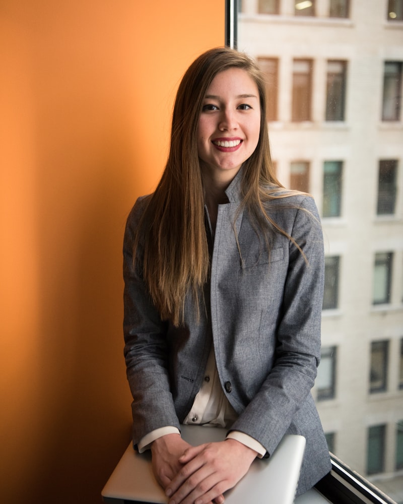 Professional in business attire representing a SOC manager or team lead